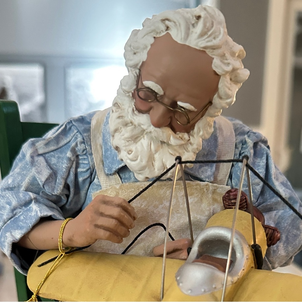 Handcrafted Santa with Yellow Airplane Figurine